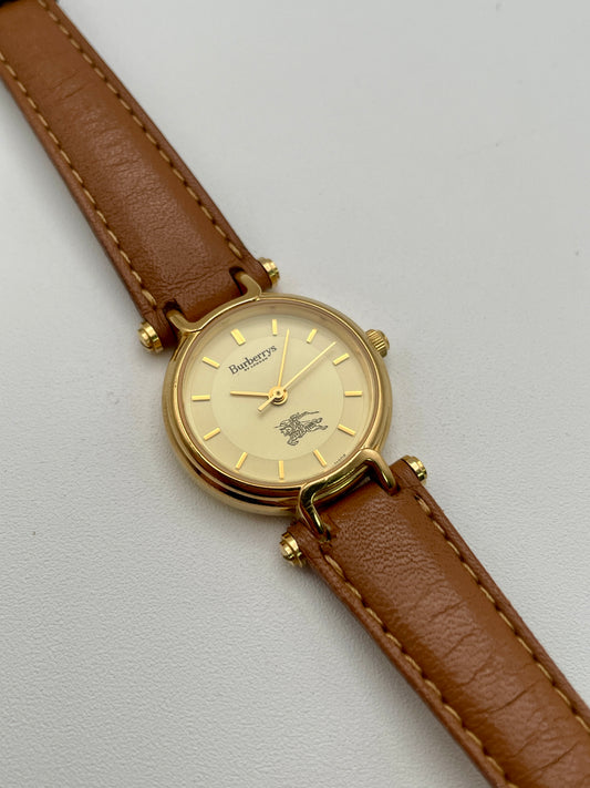 Main view of Burberry 3200 vintage women’s watch in gold with light brown leather strap
