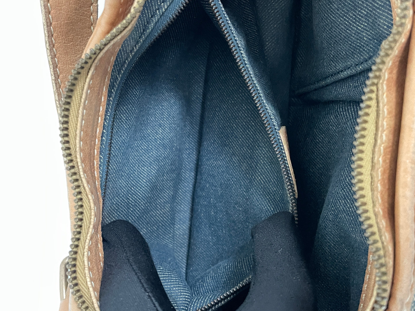 Inside view of the interior zipper pocket in the Celine Macadam Shoulder Bag.