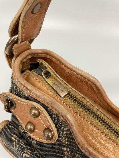 Close-up of the zipper detail on the Celine Macadam Shoulder Bag in denim, featuring the Celine logo on the pull tab.