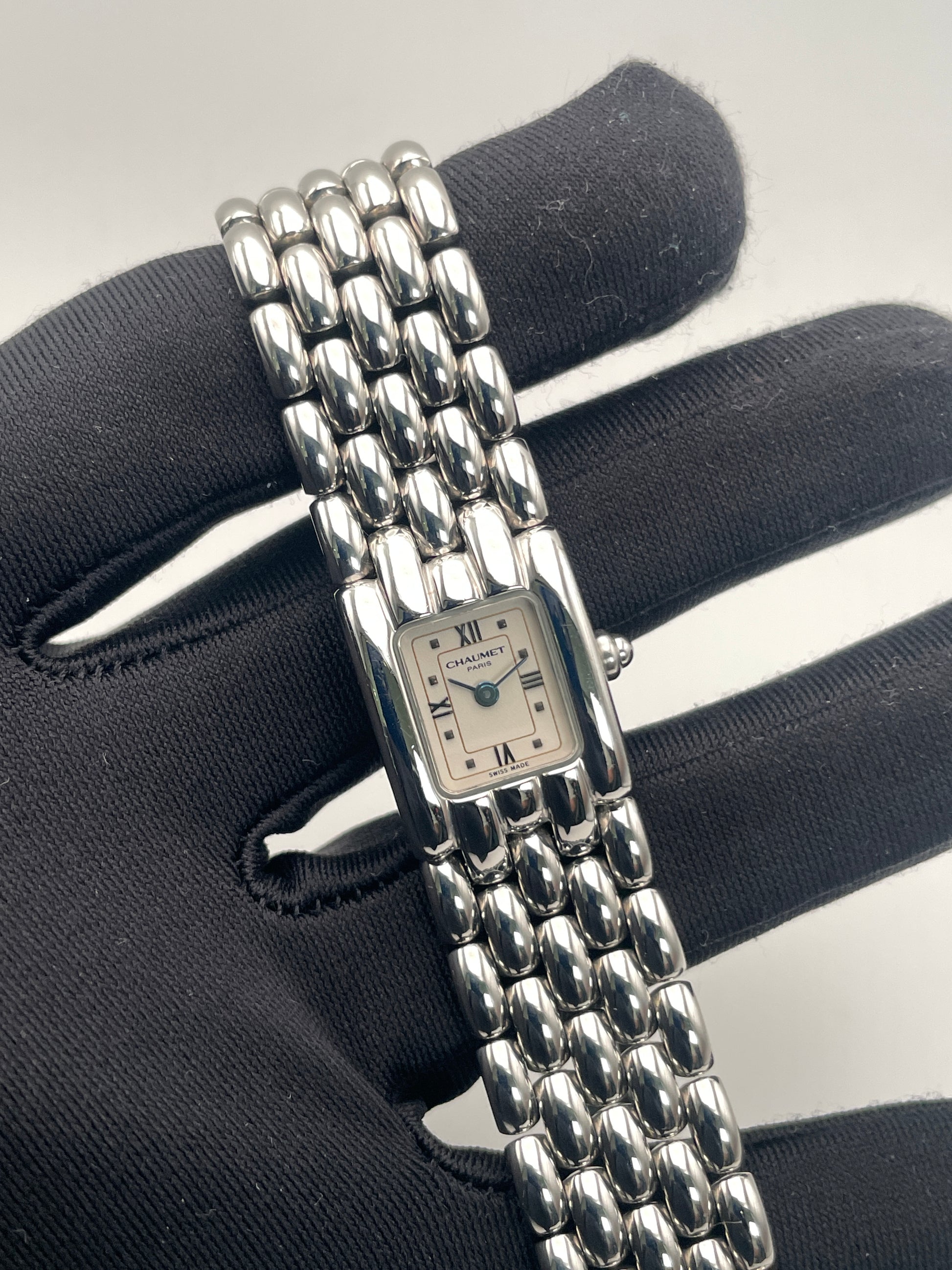 Handheld view of Chaumet Khesis Vintage Ladies Watch emphasizing the bracelet and dial design.