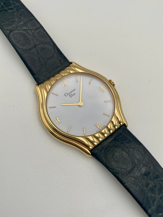 Main view of Christian Dior 3049 vintage women's watch featuring a gold case, mother-of-pearl dial, and black leather strap.