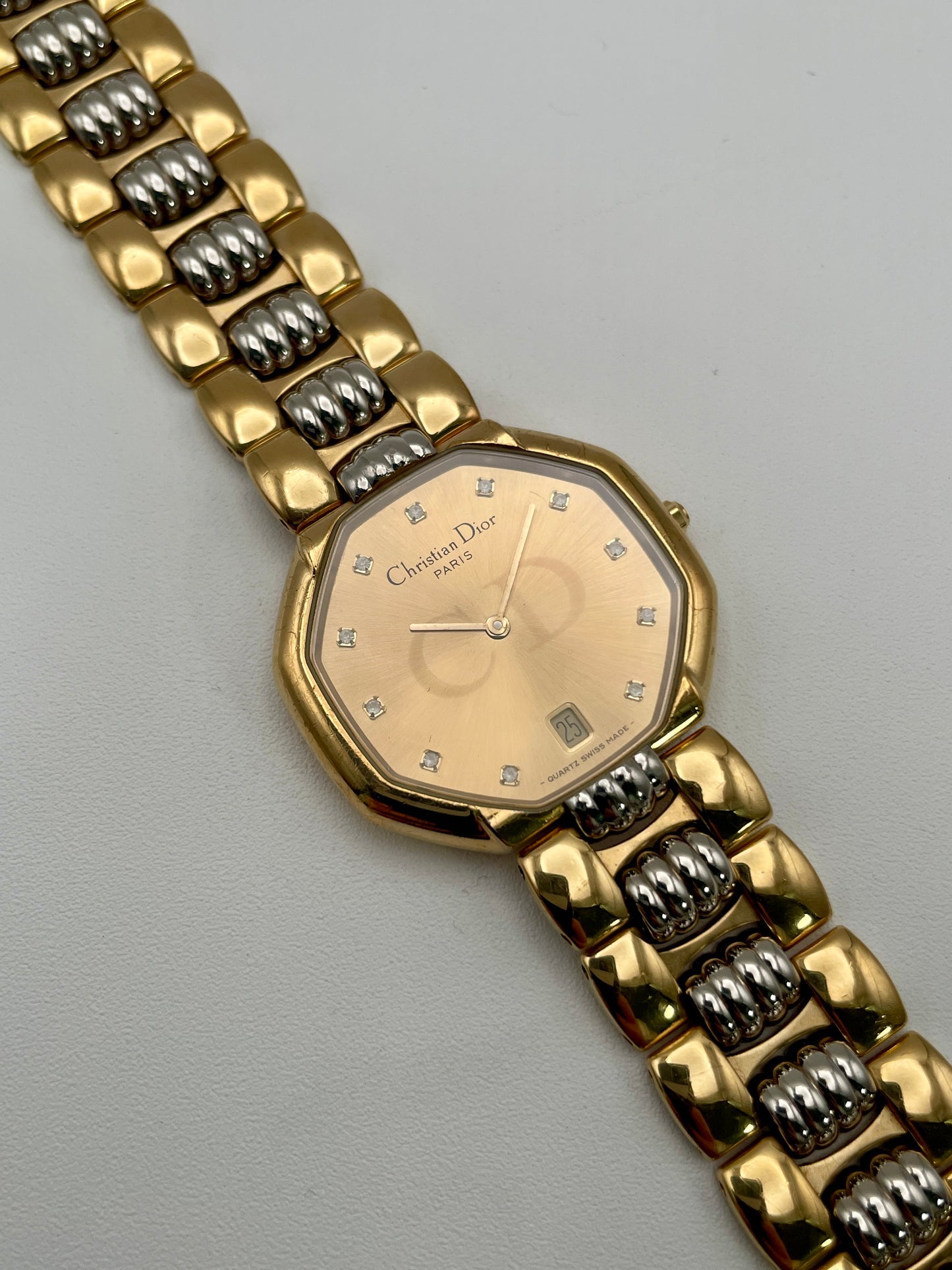 Christian Dior Déposé Octagon Vintage Women's Watch displayed flat with the unique two-tone gold and steel bracelet.