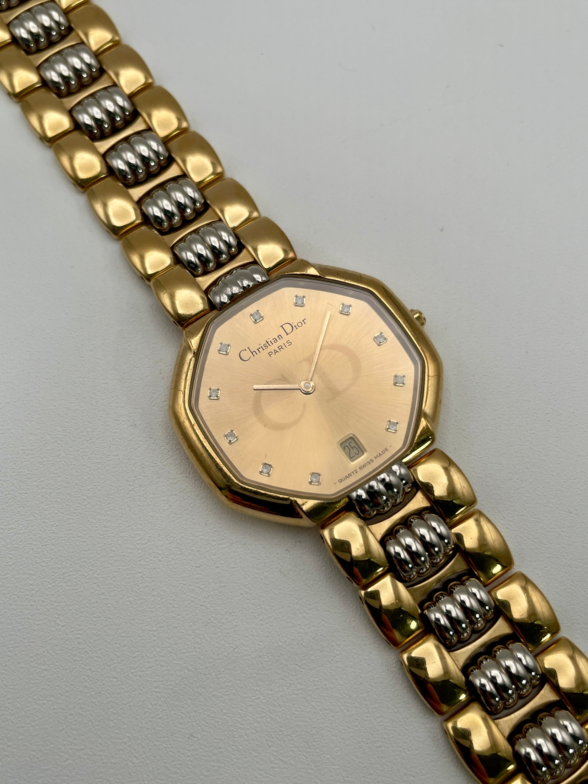 Christian Dior Déposé Octagon Vintage Women's Watch displayed flat with the unique two-tone gold and steel bracelet.