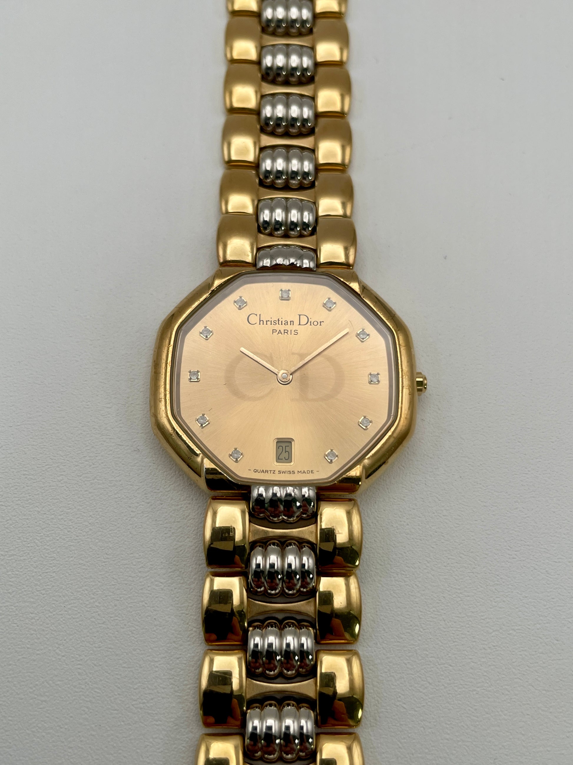 Christian Dior Déposé Octagon Vintage Women's Watch in two-tone gold and steel, front view highlighting the champagne dial with crystal markers.