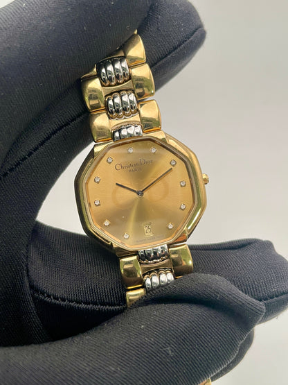 Handheld view of Christian Dior Déposé Octagon Vintage Women's Watch emphasizing the octagonal case and two-tone bracelet.