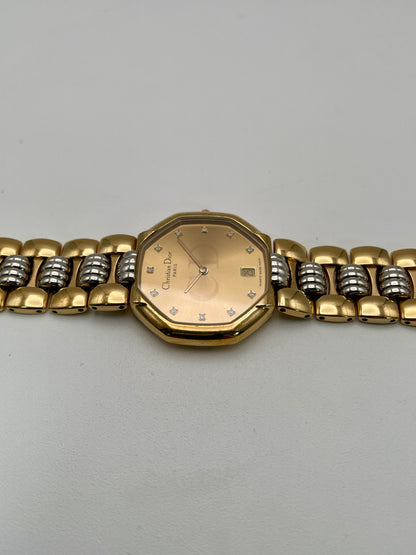Christian Dior Déposé Octagon Vintage Women's Watch laid flat, highlighting the champagne dial and two-tone bracelet.