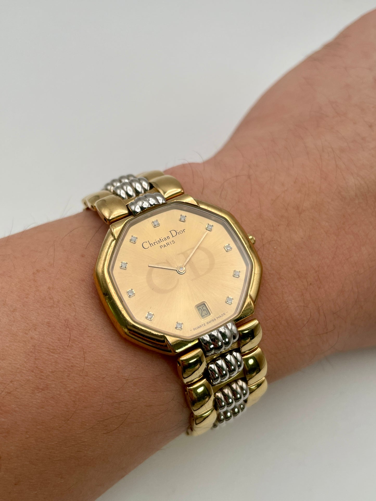 Christian Dior Déposé Octagon Vintage Women's Watch worn on the wrist, showcasing its elegant fit and champagne dial.