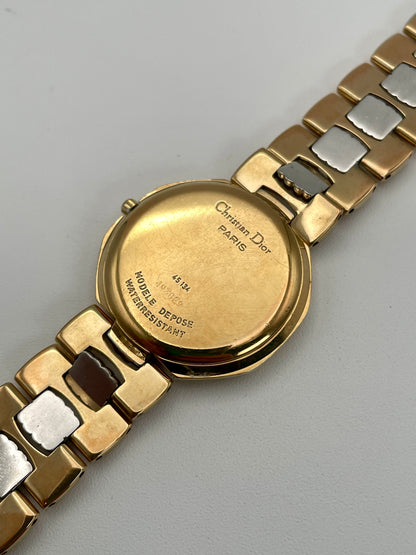 Back view of the Christian Dior Depose vintage watch, displaying the case back with model details and the two-tone bracelet.
