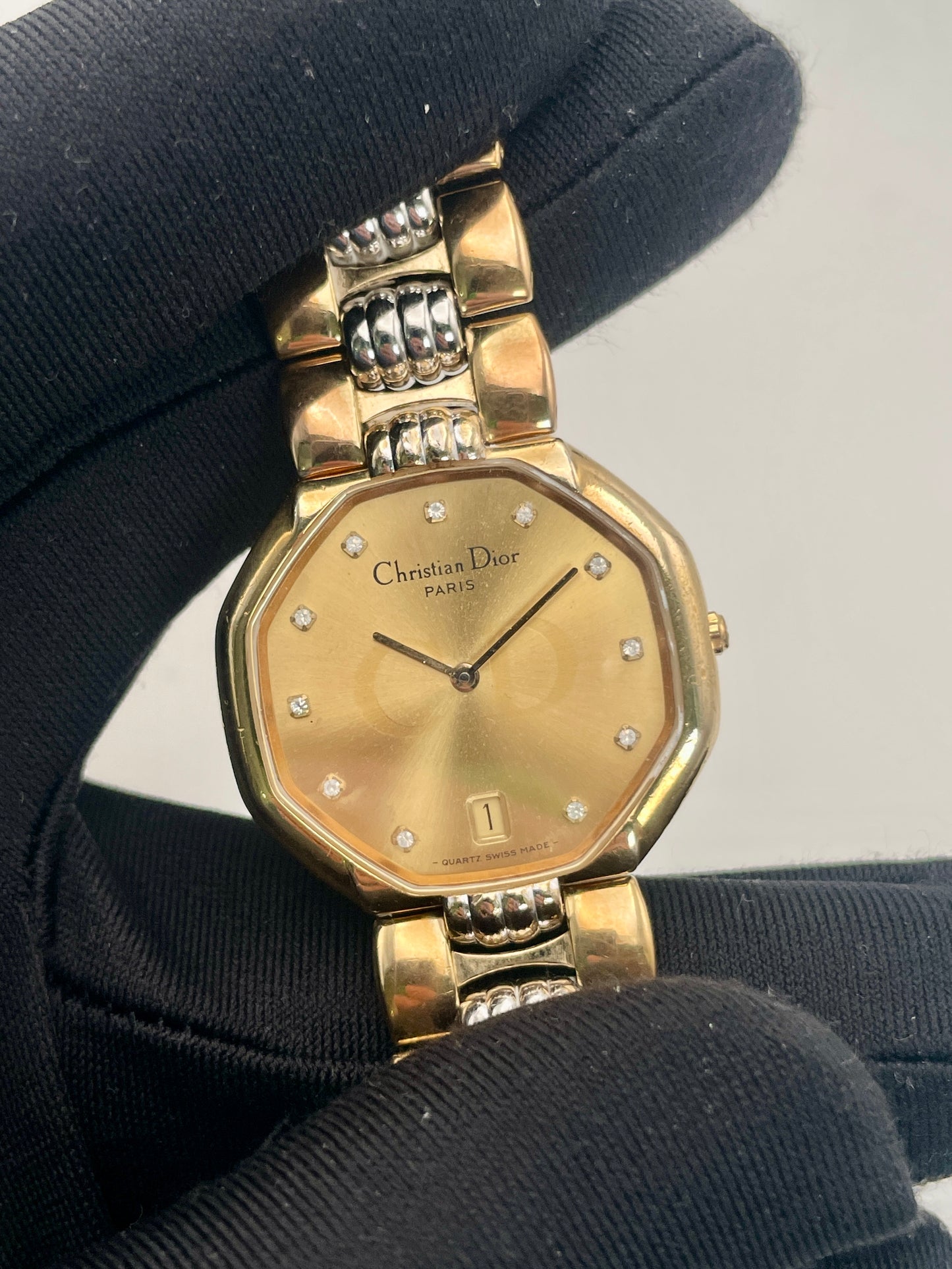 Close-up of the dial on the Christian Dior Depose vintage watch, highlighting the diamond-like markers, date window, and Dior branding.