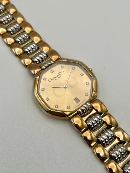 Christian Dior Depose vintage women's watch in two-tone gold and steel, showing octagonal dial with diamond-like markers and date window at 6 o'clock.