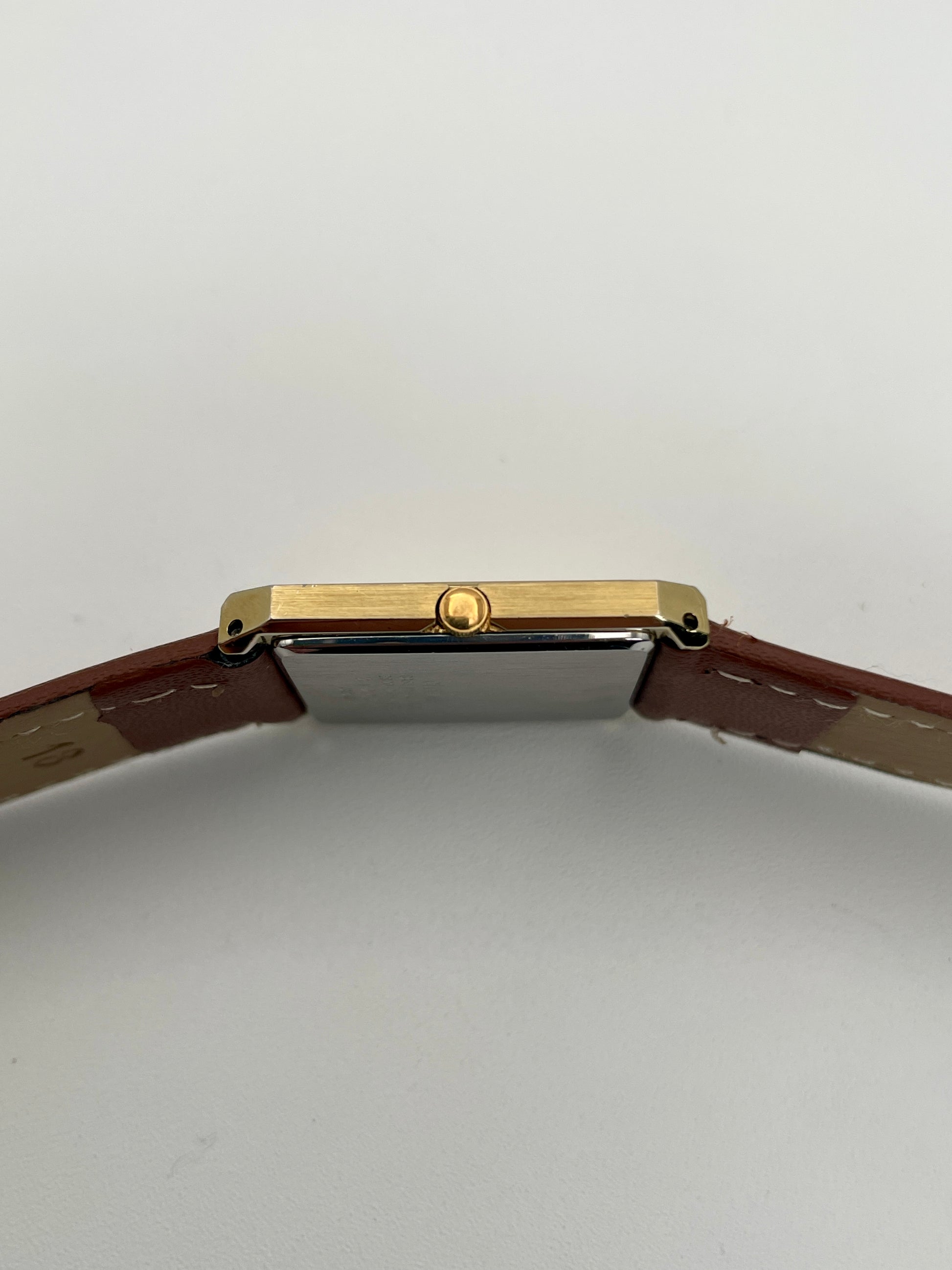 Close-up of the crown on Citizen Tank Vintage Watch with gold-tone case.