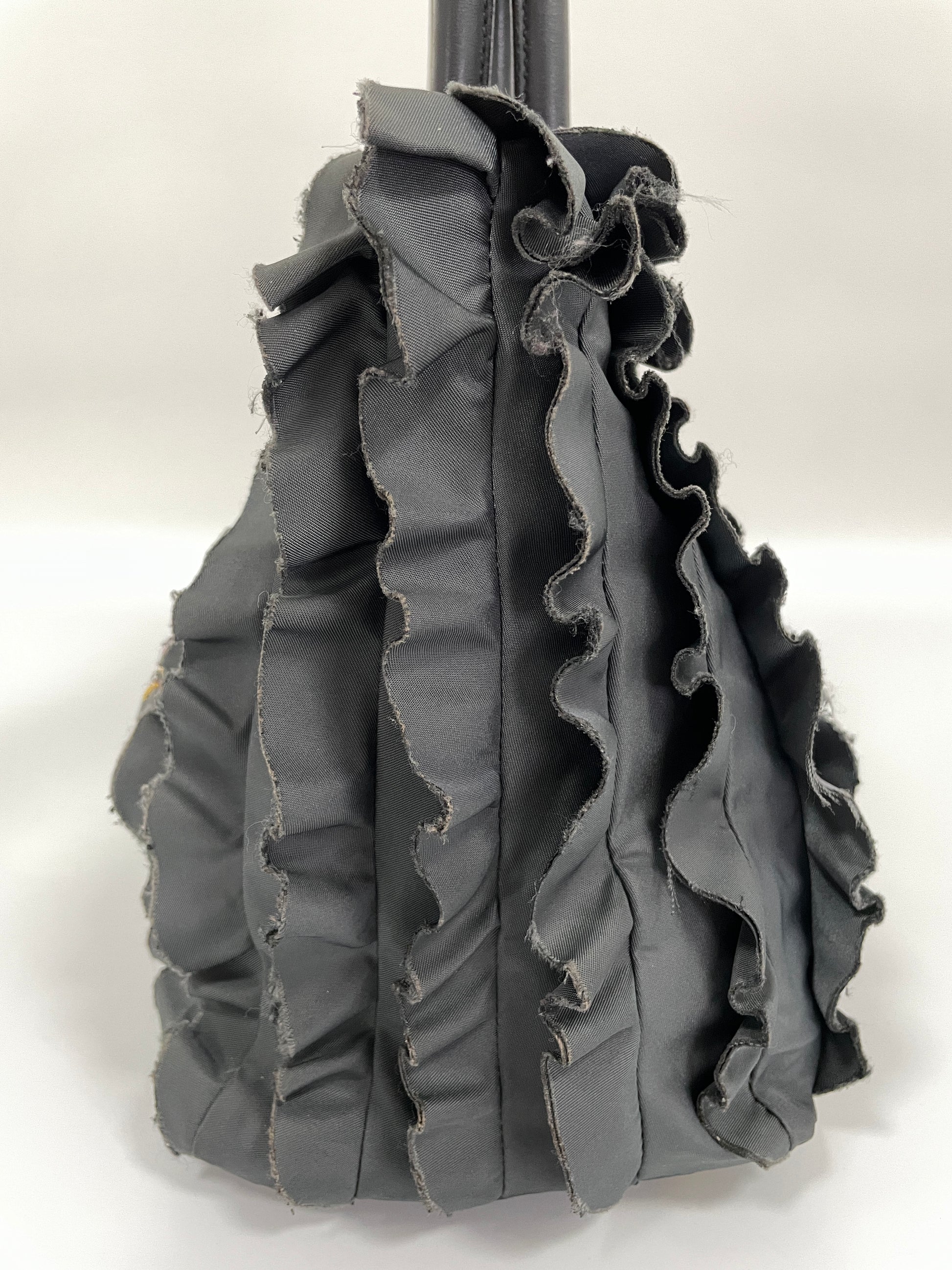 Alternate side view of Prada Tessuto Ruffle Bag in grey nylon with visible ruffle layers.