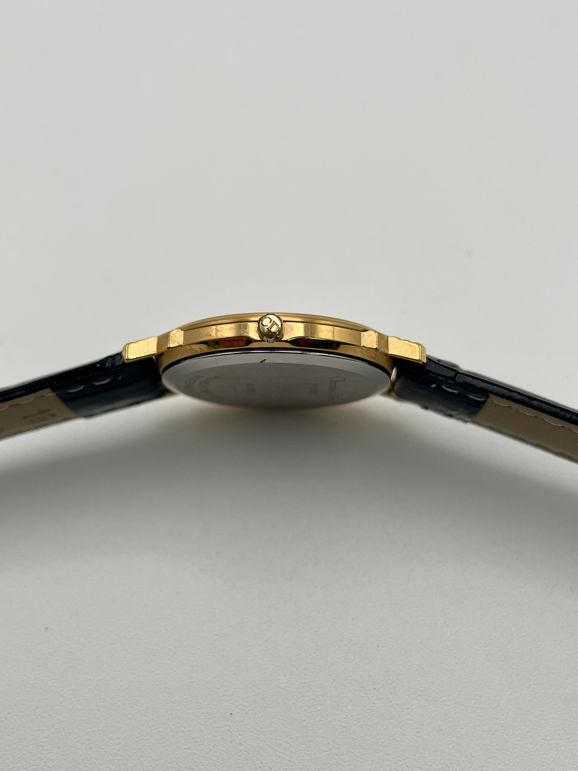 Side view of Christian Dior 45.122 watch showing crown with CD logo
