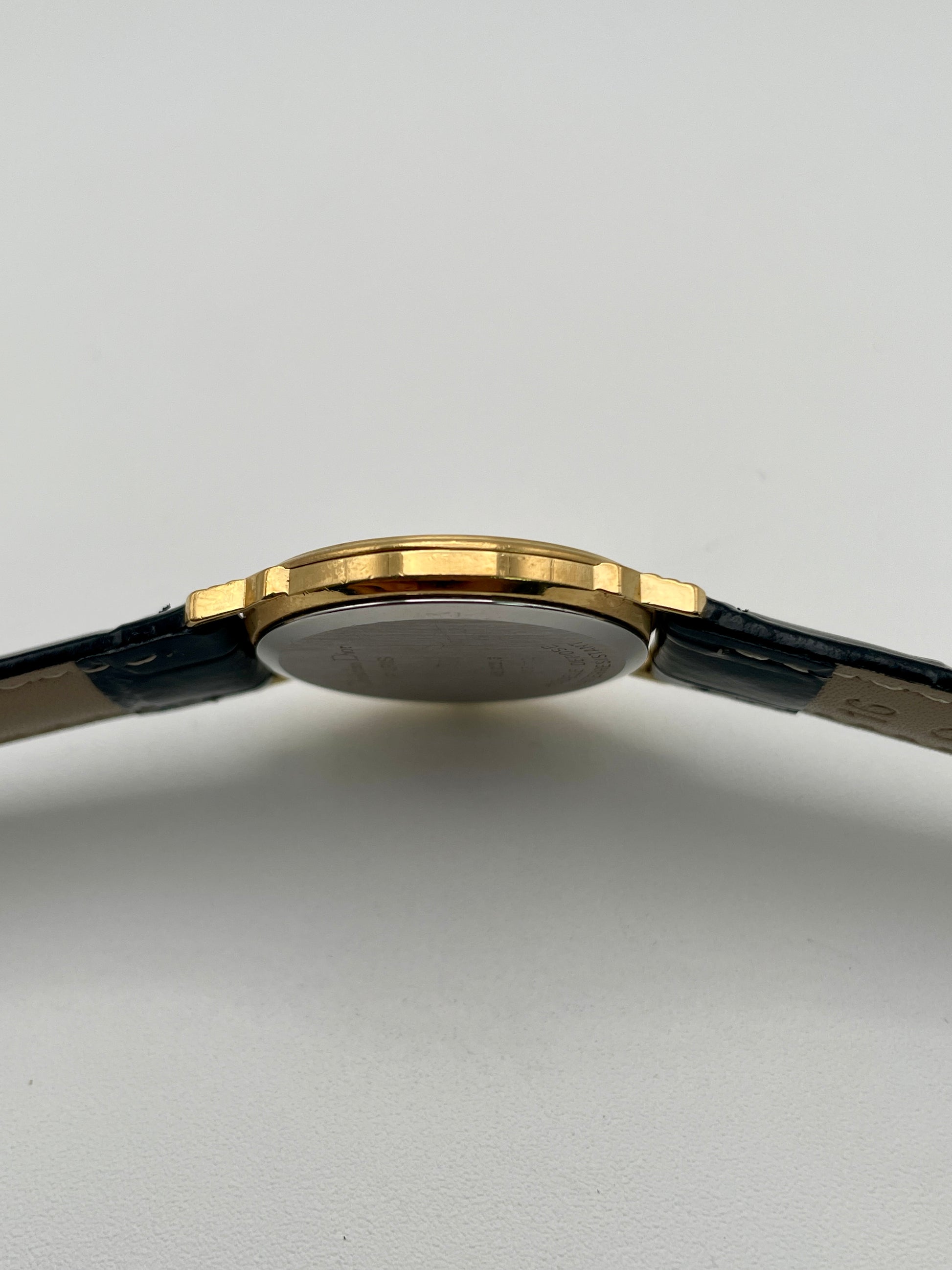 Side view of Christian Dior 45.122 gold-tone case showing slim profile
