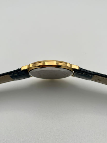 Side view of Christian Dior 45.122 gold-tone case showing slim profile
