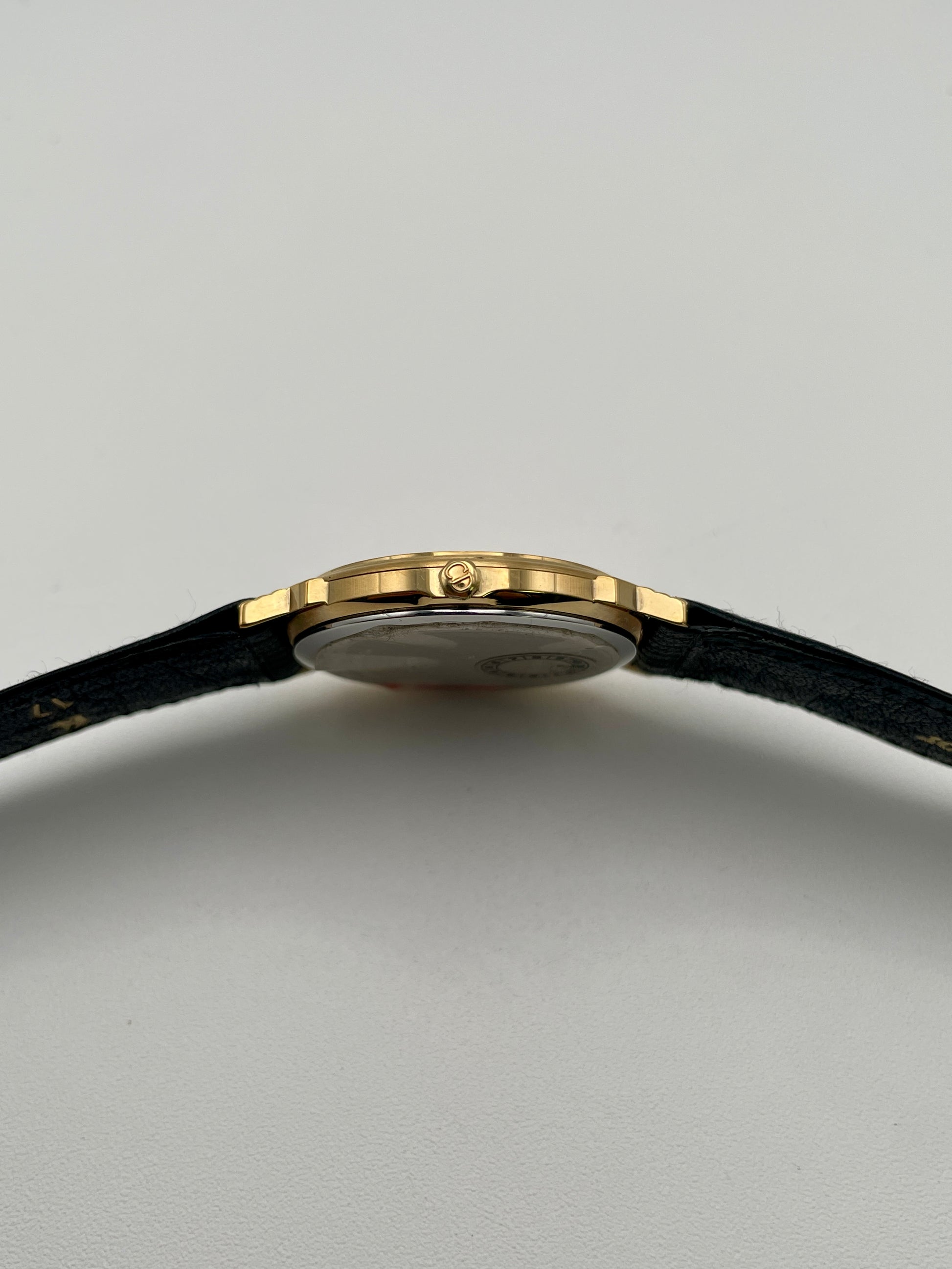 Side view showing crown of Christian Dior 45.122 vintage gold watch
