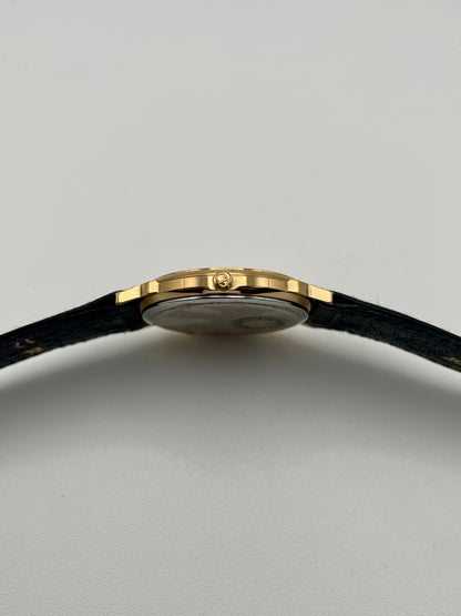 Side view showing crown of Christian Dior 45.122 vintage gold watch
