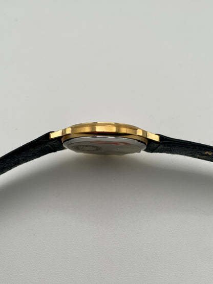 Left side profile of Christian Dior 45.122 vintage watch in gold case
