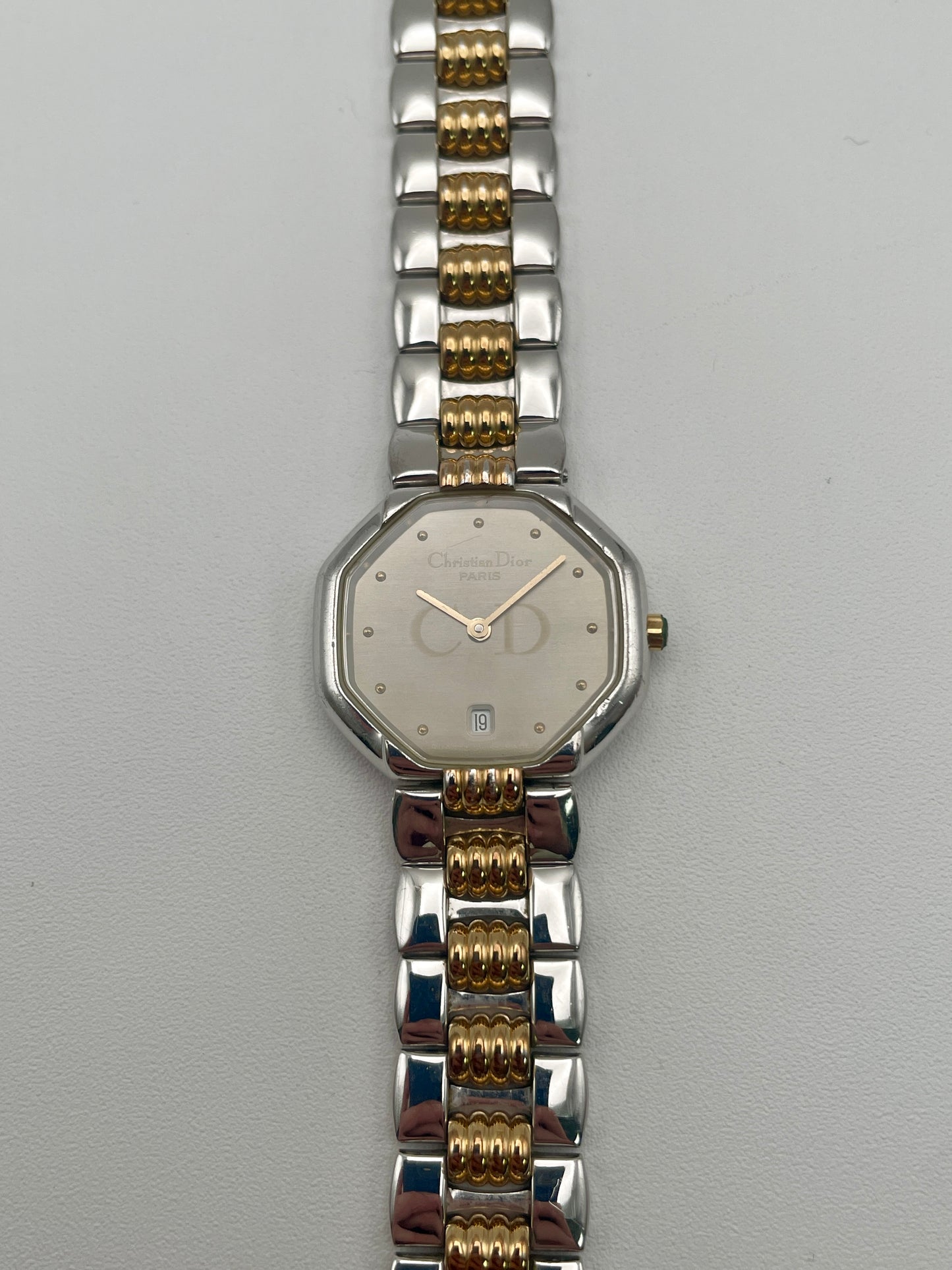Front view of the Christian Dior Déposé Octagon vintage women's watch with a champagne dial and gold-tone markers.