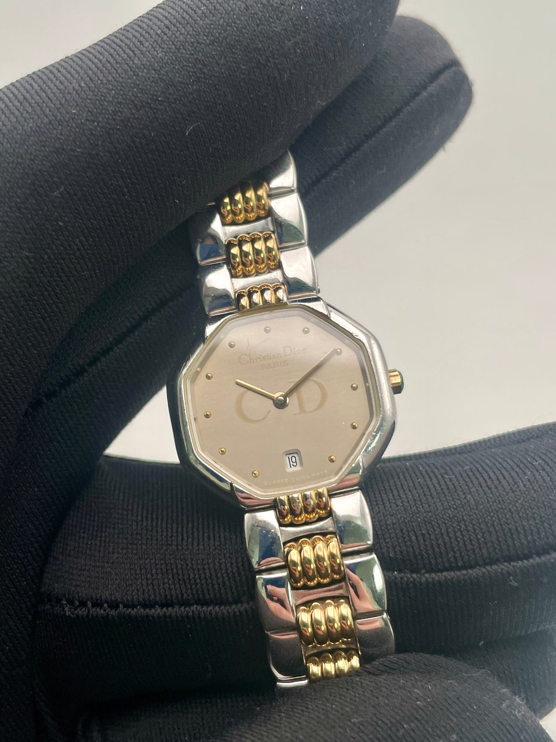 Christian Dior Déposé Octagon vintage women's watch in a handheld close-up, highlighting its refined craftsmanship.
