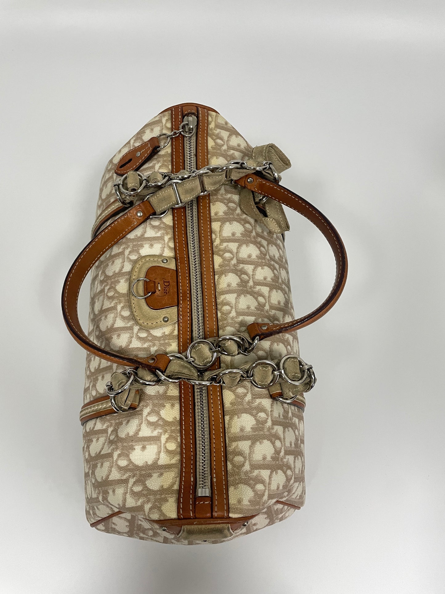 Top view of Christian Dior Trotter Romantique bag in beige leather and canvas with chain and leather straps.