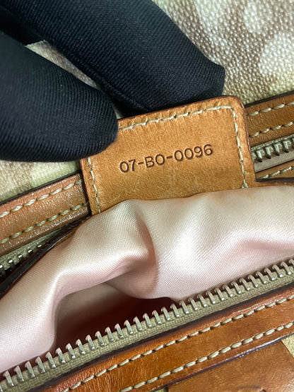 Close-up of the serial number tag inside the Christian Dior Trotter Romantique Bag in beige leather and canvas, displaying "07-BO-0096."