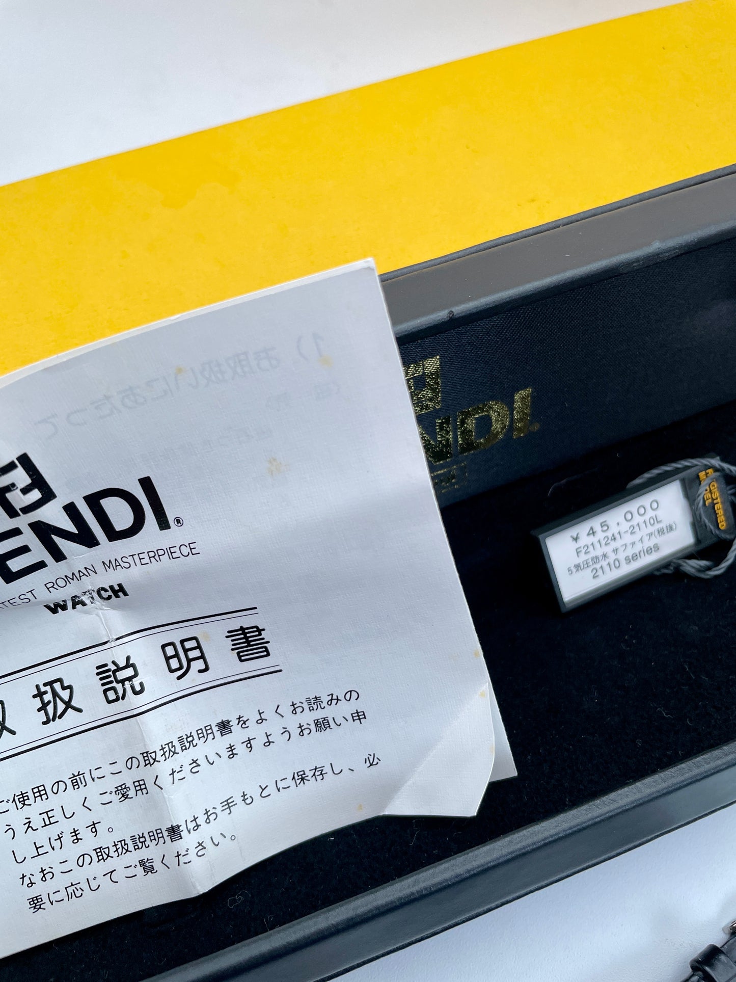 Fendi 2100L watch inside box with original tag and Japanese instruction manual