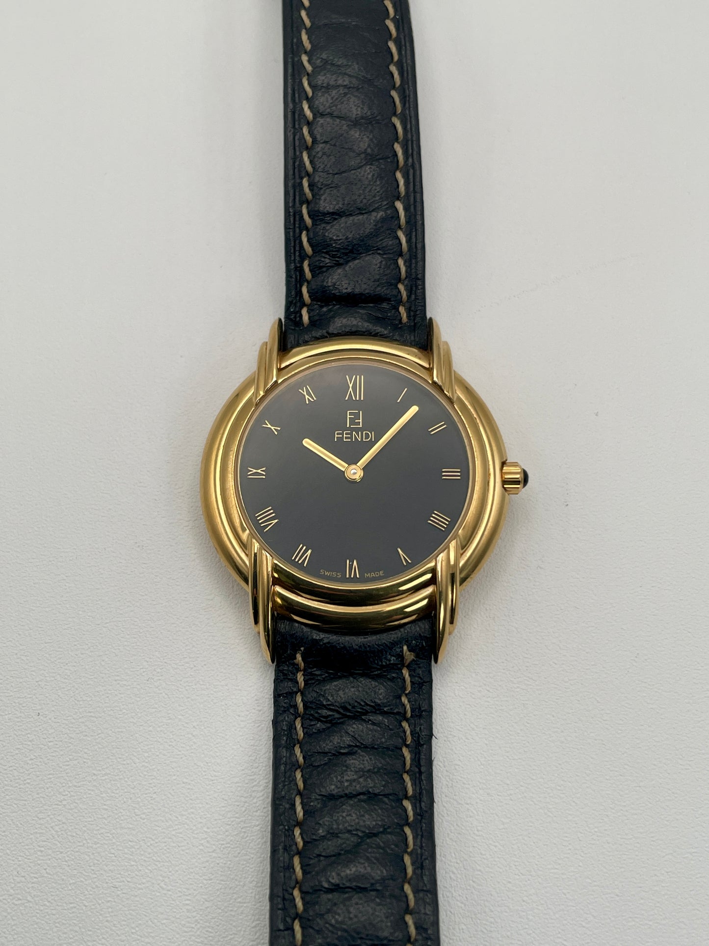 Close-up view of the Fendi 300J dial, showing refined Roman numerals and dauphine-style hands.