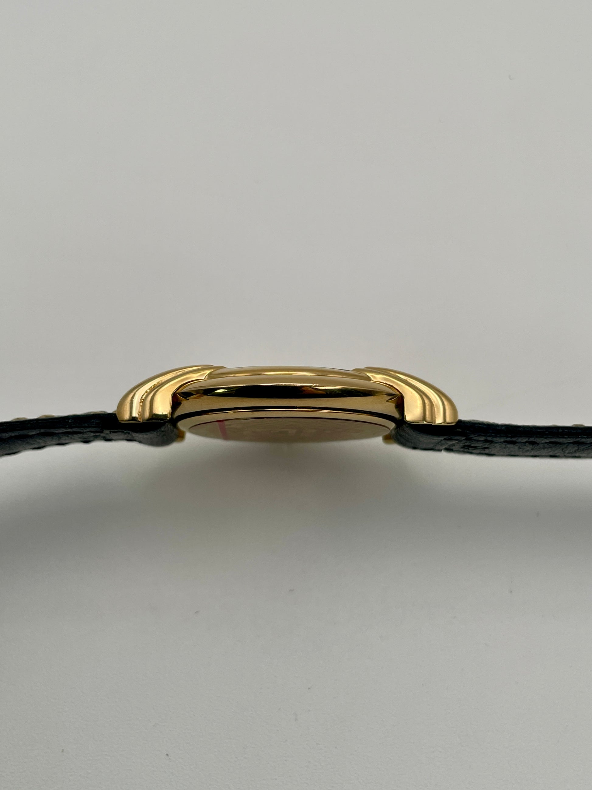 Side profile of the Fendi 300J showing the slim gold case and curved lugs.