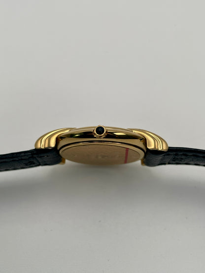 Close-up side view highlighting the small cabochon crown on the Fendi 300J gold case.