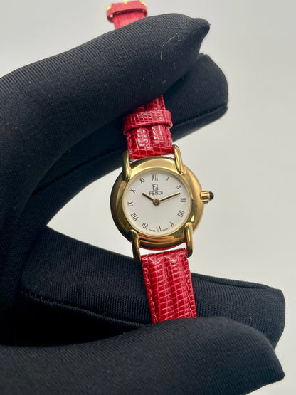 Close-up view of the Fendi Orologi 410L watch showing dial details and strap texture