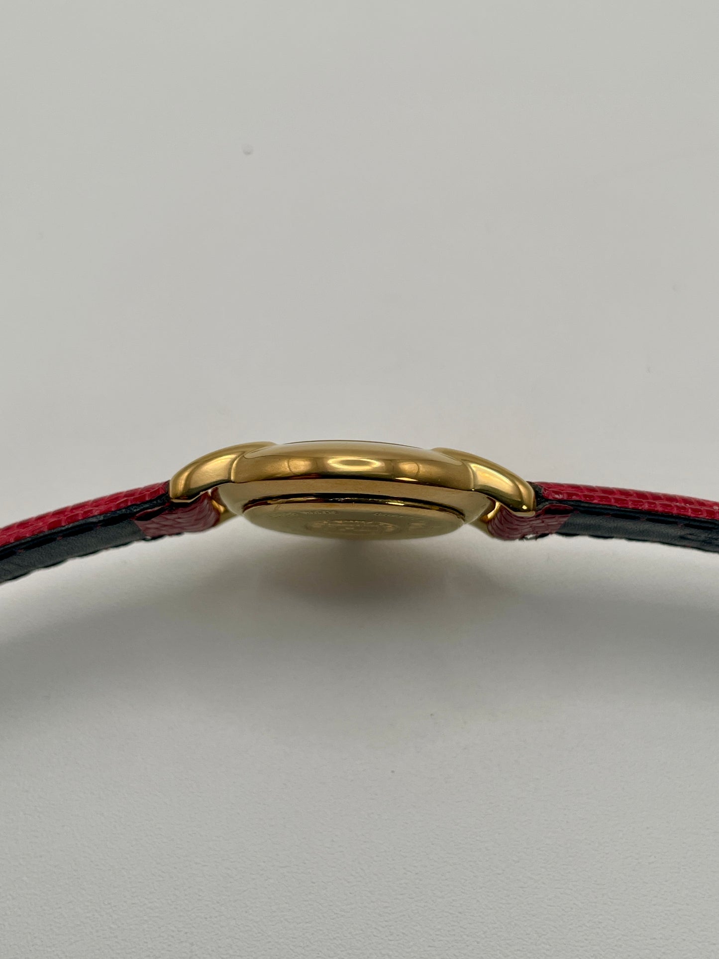 Side view of the watch case showing the thin gold profile of the Fendi 410L