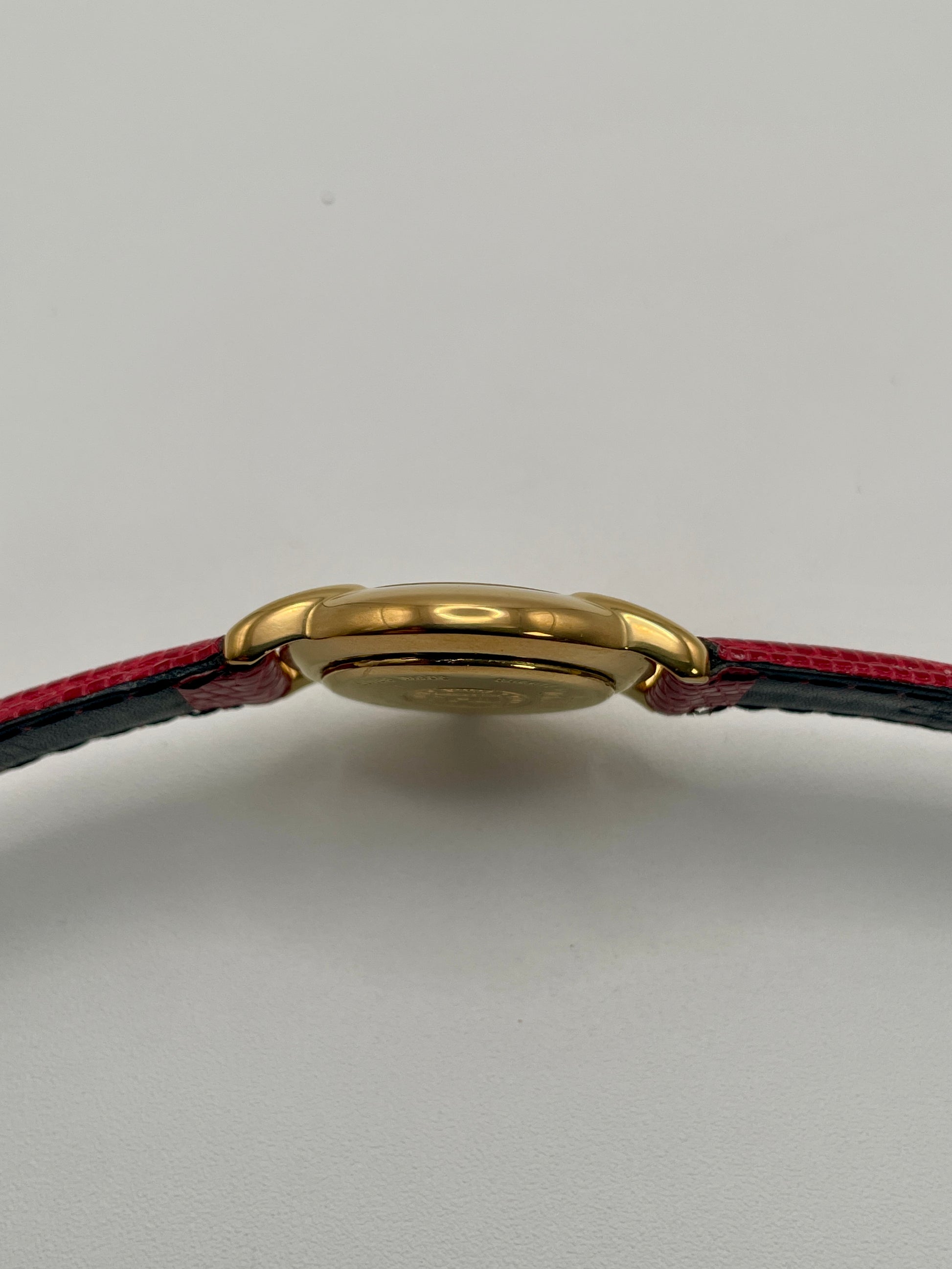 Side view of the watch case showing the thin gold profile of the Fendi 410L