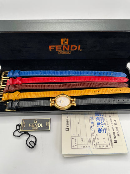 Fendi 640L watch with gold case, multi-colored interchangeable leather straps, and original box with papers.