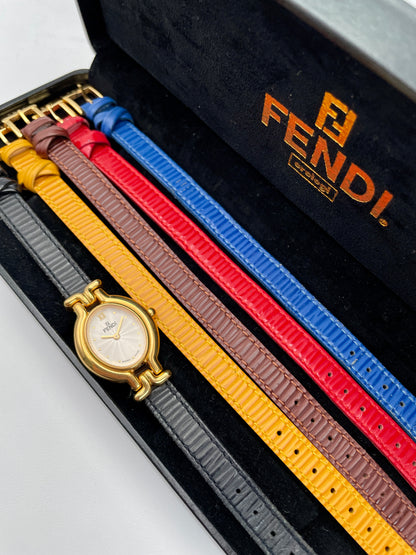 Fendi 640L watch with gold case, multi-colored interchangeable leather straps, and original box with papers.