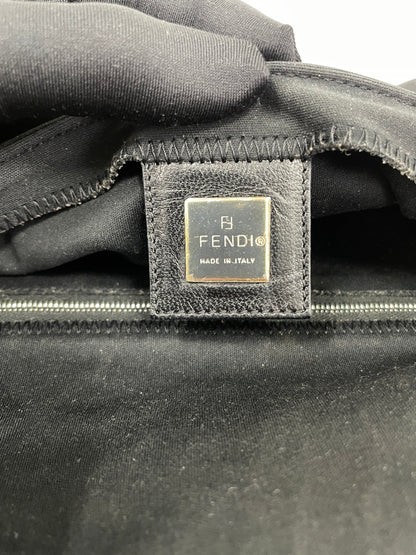 Inside view of the Fendi Baguette Bag in black neoprene, featuring the Fendi logo patch and zipper.