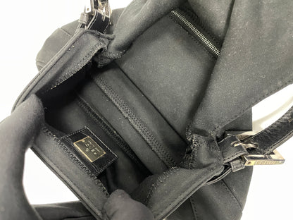 Interior of the Fendi Baguette Bag in black neoprene, showing the spacious compartment and inner zip pocket.