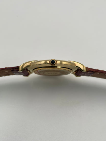 Close-up of the crown and side profile of the Fendi Orologi 410G vintage watch in gold.