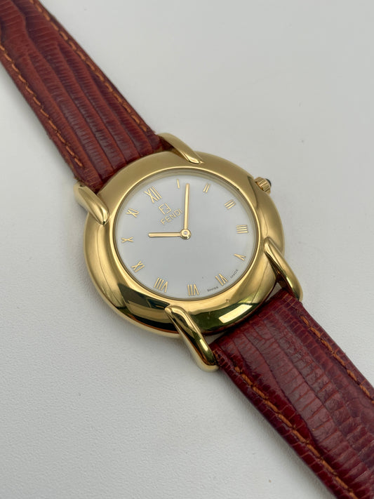 Main view of the Fendi Orologi 410G vintage watch showcasing its elegant gold case and red leather strap.