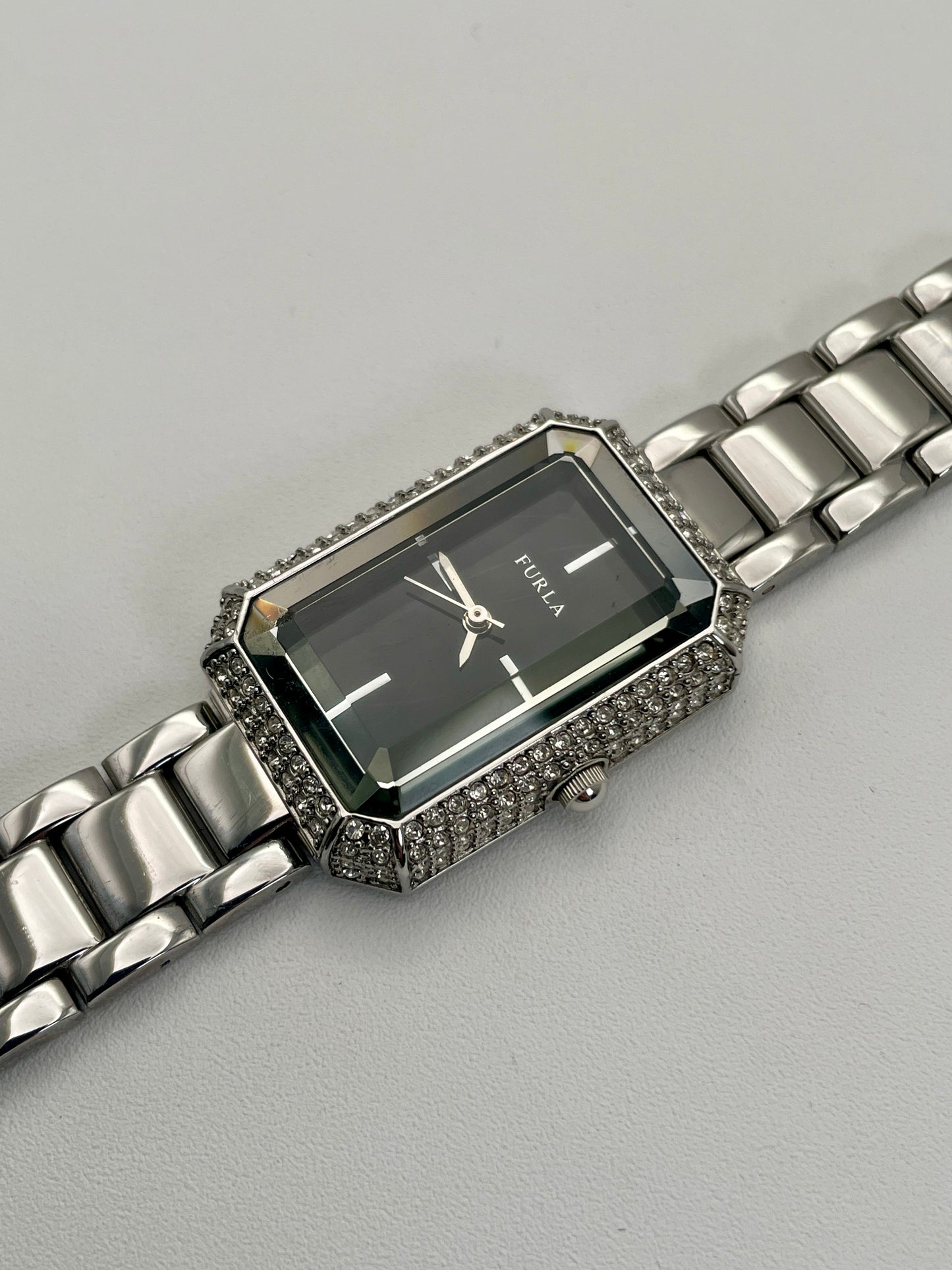 Diagonal view of Furla Crystal Pave watch, highlighting the rectangular case adorned with crystals and the black dial.