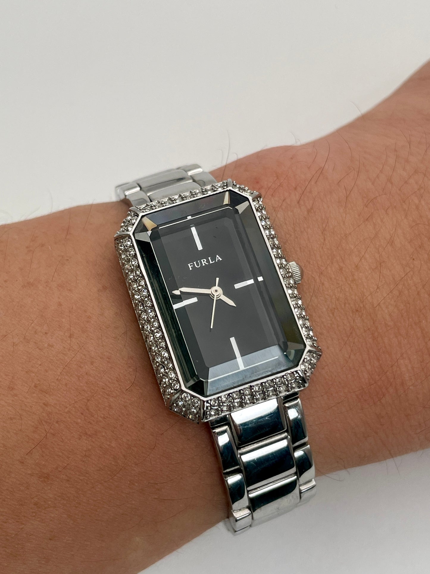 Wrist shot view of Furla Crystal Pave ladies' watch, demonstrating its fit and sparkle on the wrist with a crystal-set case and stainless steel bracelet.