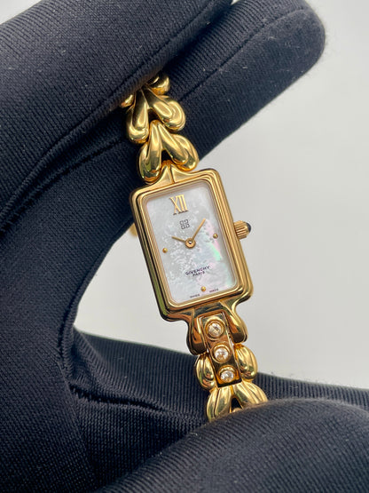 Close-up of the Givenchy Bambou watch showing dial details, crystal accents, and bracelet texture