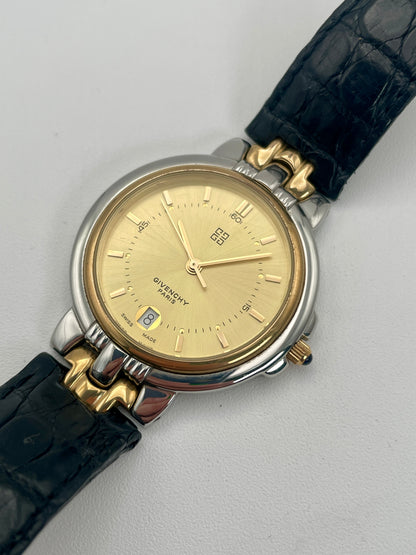 Diagonal view of Givenchy Chenonceaux vintage ladies' watch, highlighting the gold-tone dial, two-tone case, and leather strap.