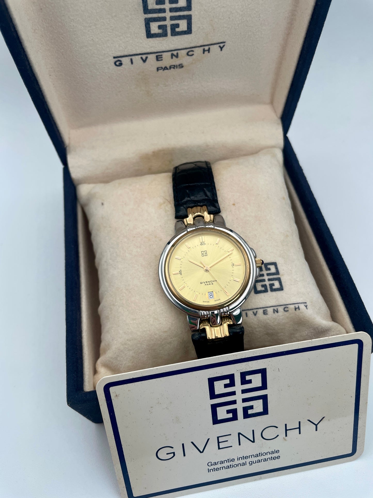 Givenchy Chenonceaux vintage ladies' watch in gold and steel displayed inside its original branded box with warranty card.