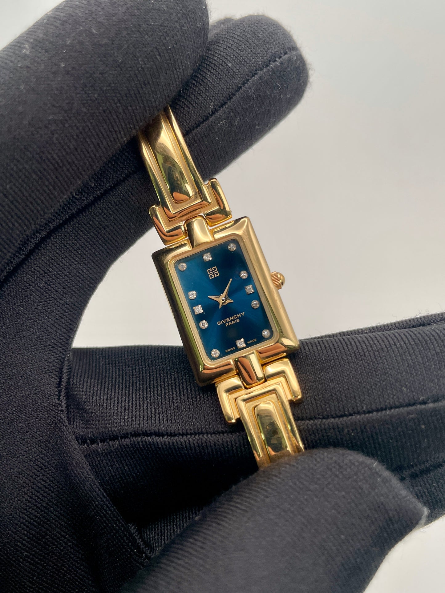 Close-up view of the Givenchy Millesime watch showcasing the rectangular case and crystal-set dial