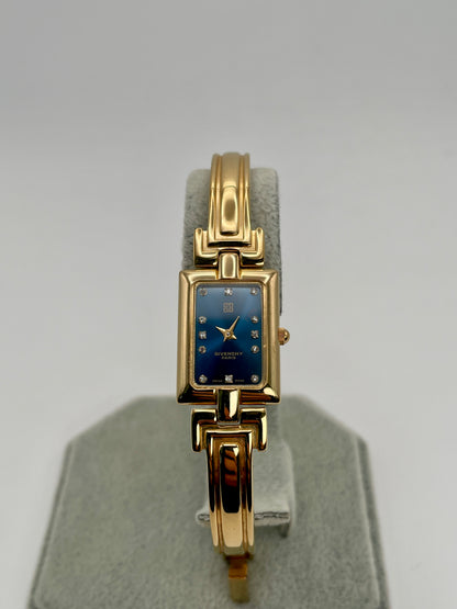 Front view of the Givenchy Millesime Vintage Women’s Watch showing the gold rectangular case and blue dial with crystal hour markers