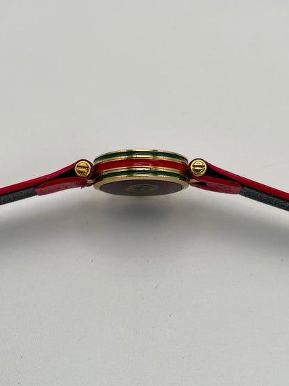 Horizontal side profile of the Gucci Sherry Line watch showing the enamel detailing and gold crown.