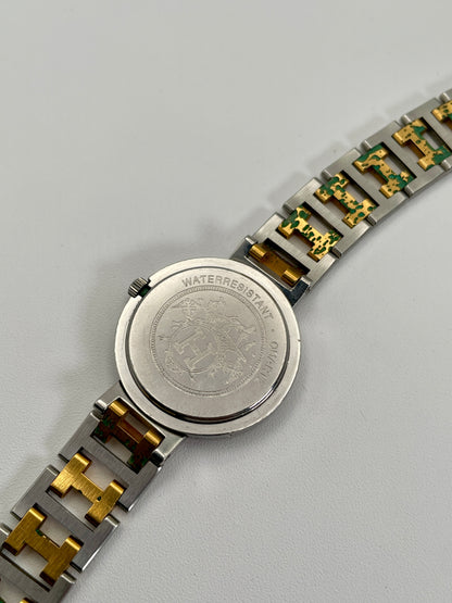 Caseback view of the Hermes Clipper 30mm two-tone watch, showing the stainless steel back with water resistance markings and the two-tone bracelet.