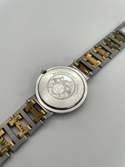 Caseback view of Hermes Clipper Men's 35mm watch highlighting the stainless steel back with engraved details, and two-tone iconic H style bracelet.