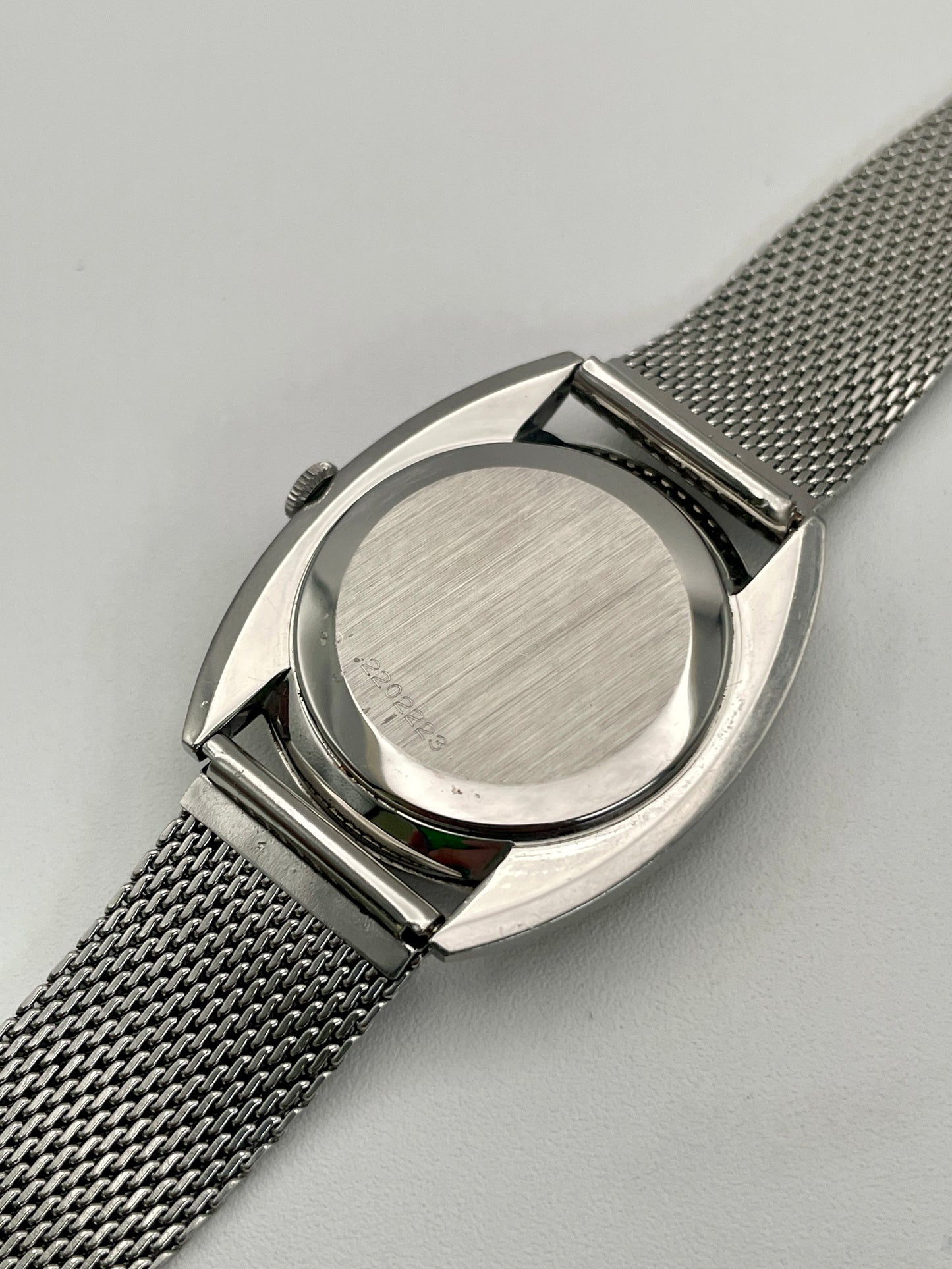 Back case of IWC Ref. 2403 VWS-2525, displaying brushed steel finish.
